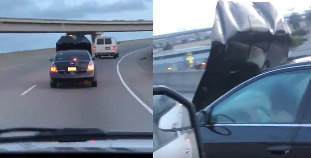 Una mujer conduce por la autopista con el capó levantado y sin ver nada. 17